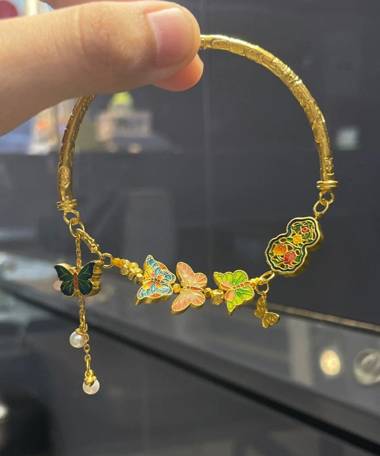 Fine Gold Ancient Gold Pearl Enamel Butterfly Tassel Bangle