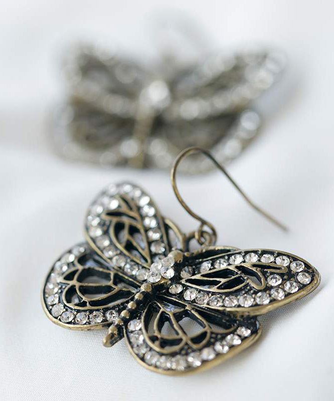 Retro White Metal Zircon Butterfly Hollow Out Stud Earrings