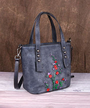 Kuriertasche aus Kalbsleder mit grauen Blumenmustern