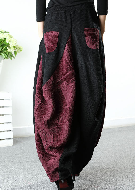 Stilvolle schwarze Patchwork-rote asymmetrische Designhose Winter