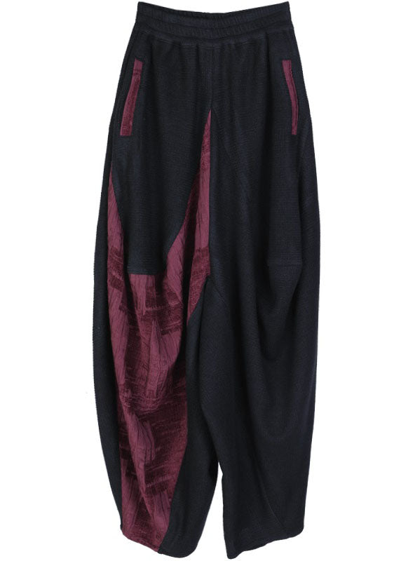 Stilvolle schwarze Patchwork-rote asymmetrische Designhose Winter